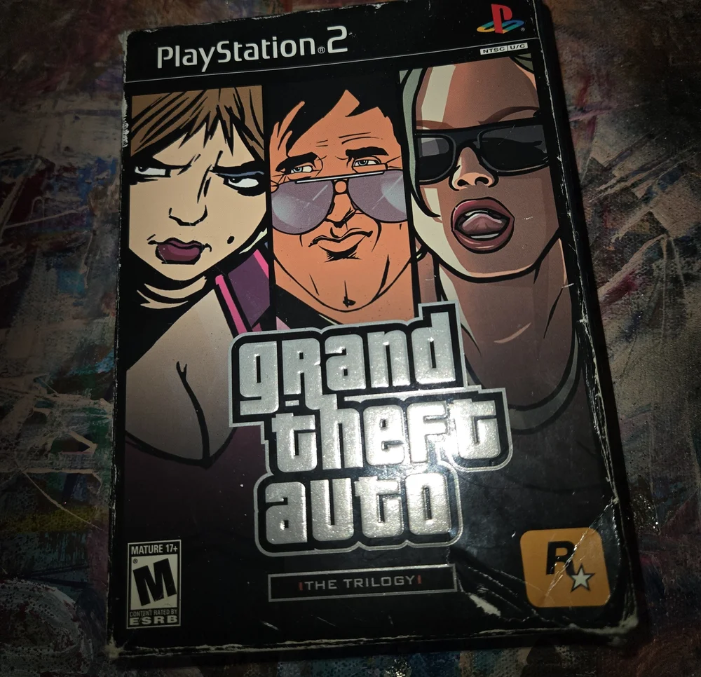 Sony PlayStation 2 Grand Theft Auto: The Trilogy — Black and Purple Cover